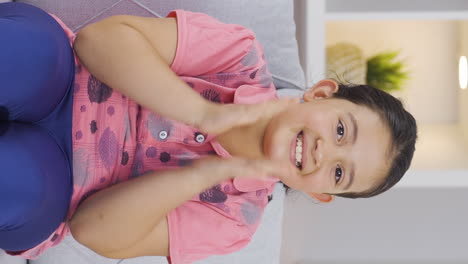 Vertical-video-of-Girl-child-clapping-looking-at-camera-congratulates.
